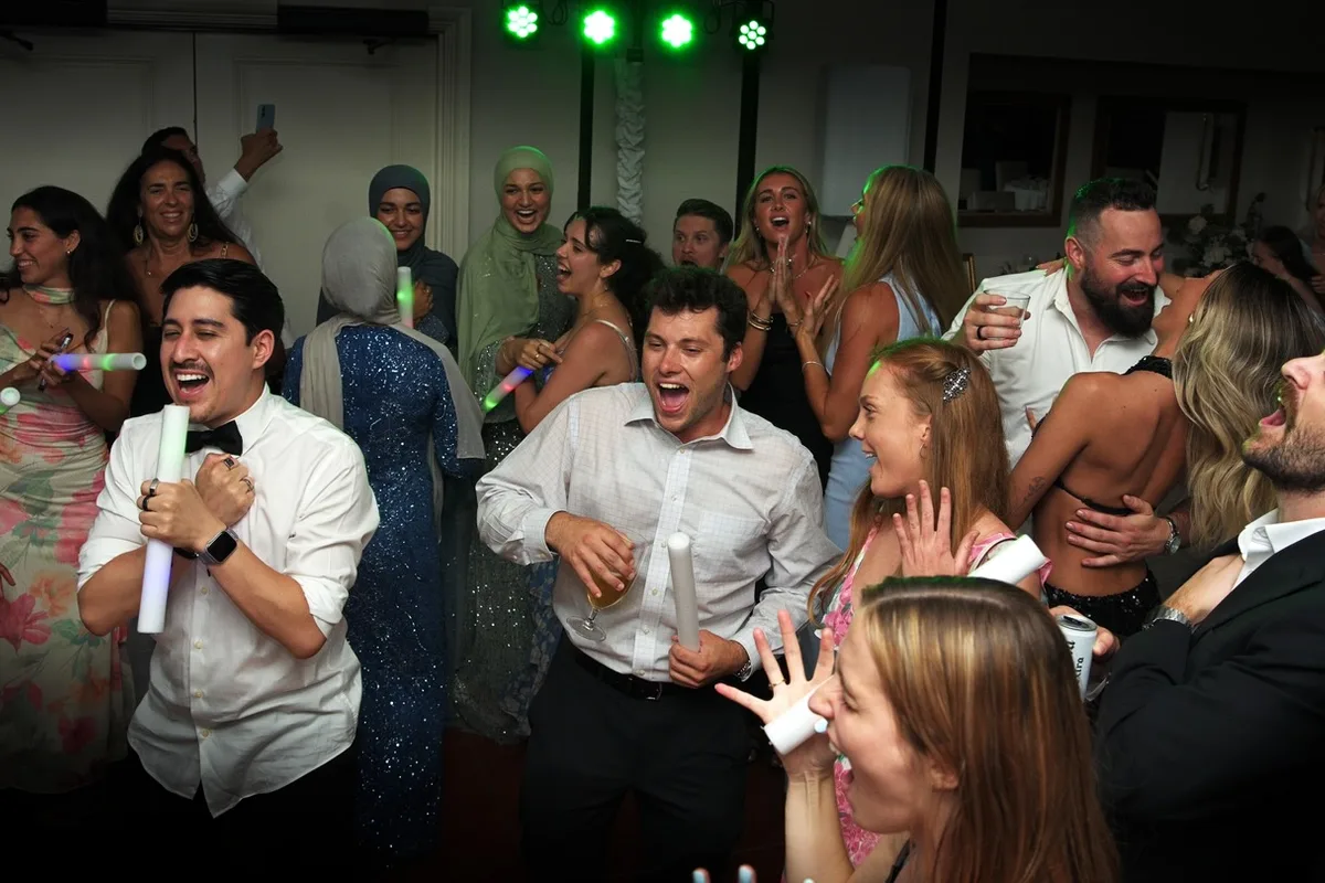 Wedding guests celebrating on the dance floor