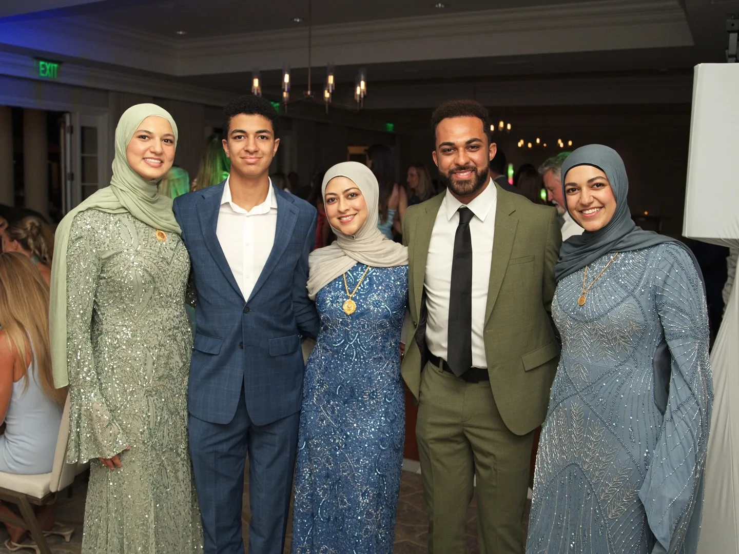 Wedding guests gathered for a portrait at a reception — event coverage by Hunter Cannon